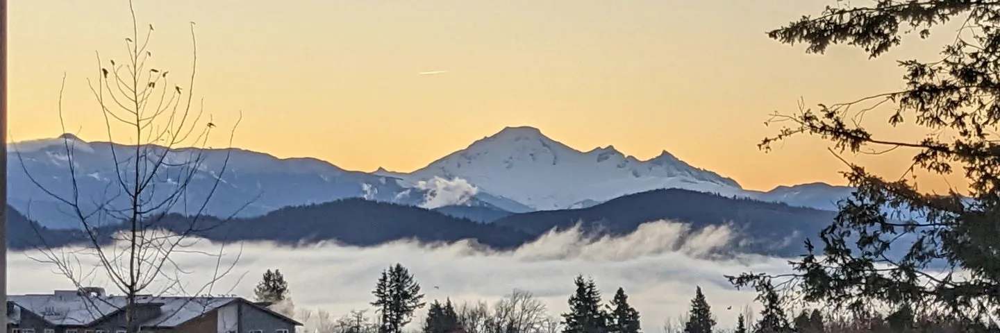 Mt. Baker at sunrise, fog filling the valley below